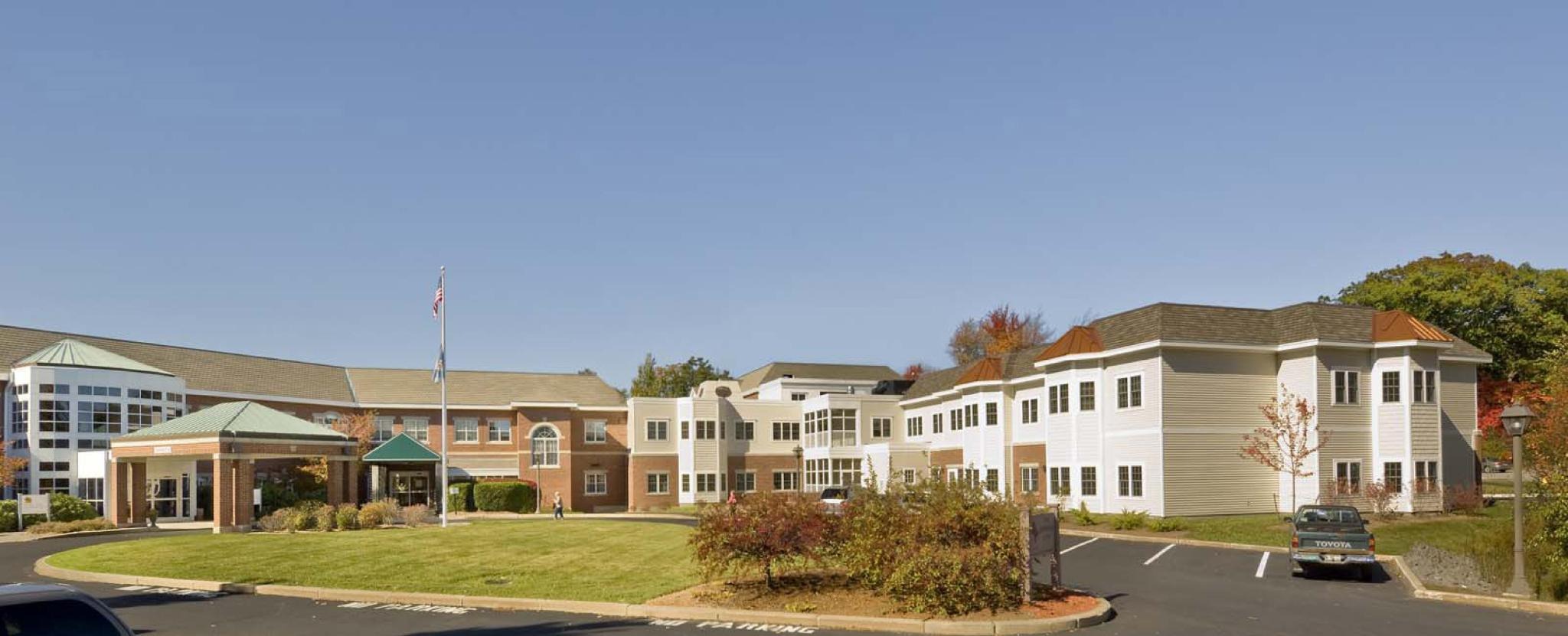 OSHER INN SOUTHEAST FACADE NURSING CENTER ON LEFT, SYMBOLIC LOUIS KAHN COOLING TOWER AT CENTER