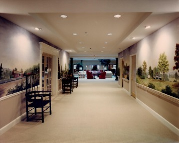 ENTRANCE GALLERY WALL MURALS DEPICTING SCENES FROM SURROUNDING VILLAGES