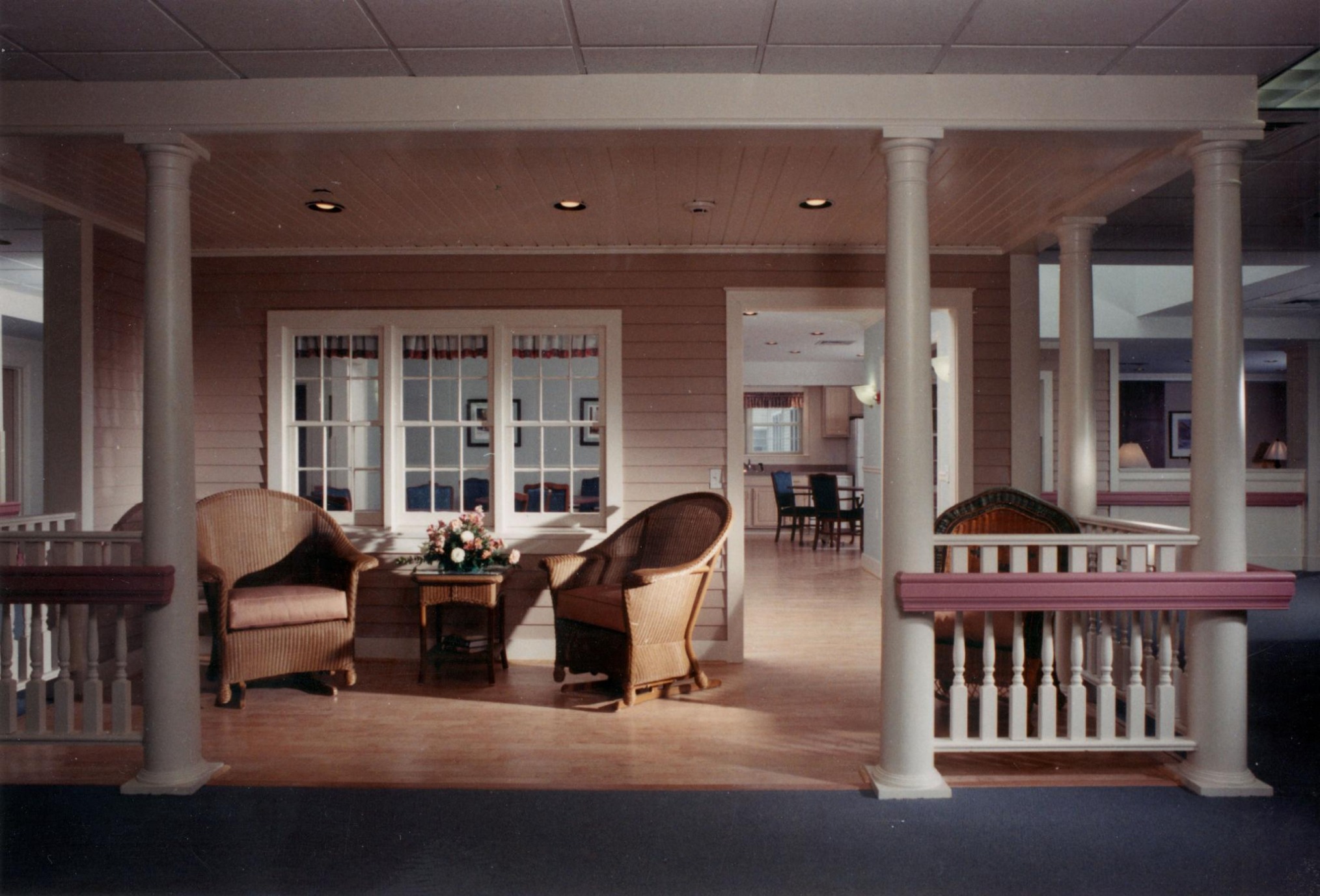 ALZHEIMER'S SPECIAL CARE UNIT COUNTRY SITTING PORCH, COUNTRY KITCHEN BEYOND