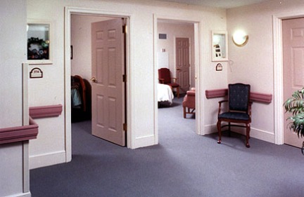 ALZHEIMER'S SPECIAL CARE UNIT ENTRANCES TO PRIVATE ROOMS, FEATURING INDIVIDUAL SHADOW BOXES